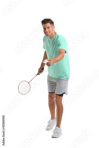 Sporty male badminton player on white background © Pixel-Shot