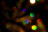 Abstract colorful glowing drops and sparkles creating a fireworks effect. Rainbow bokeh for background and overlay.