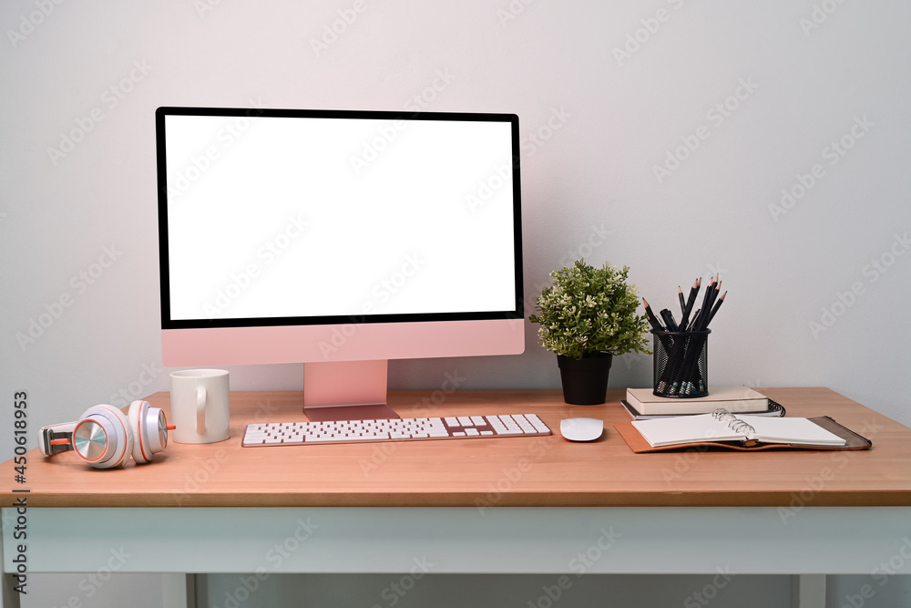 Modern workplace with computer, houseplant, headphone and coffee cup. Modern workplace with computer, houseplant, headphone and coffee cup.