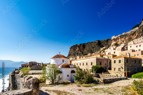 View on Monemvasia street panorama with old houses and Panagia Chrysafitissa church in ancient town, Peloponnese, Greece