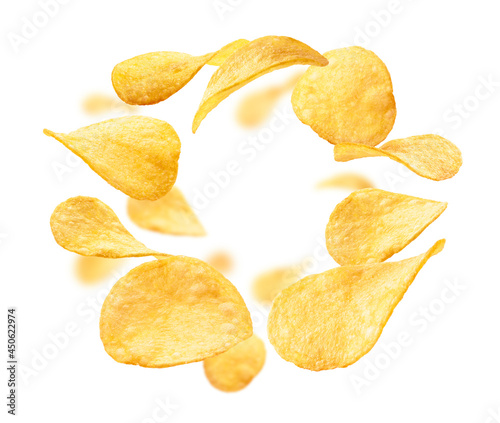 Potato chips levitate on a white background