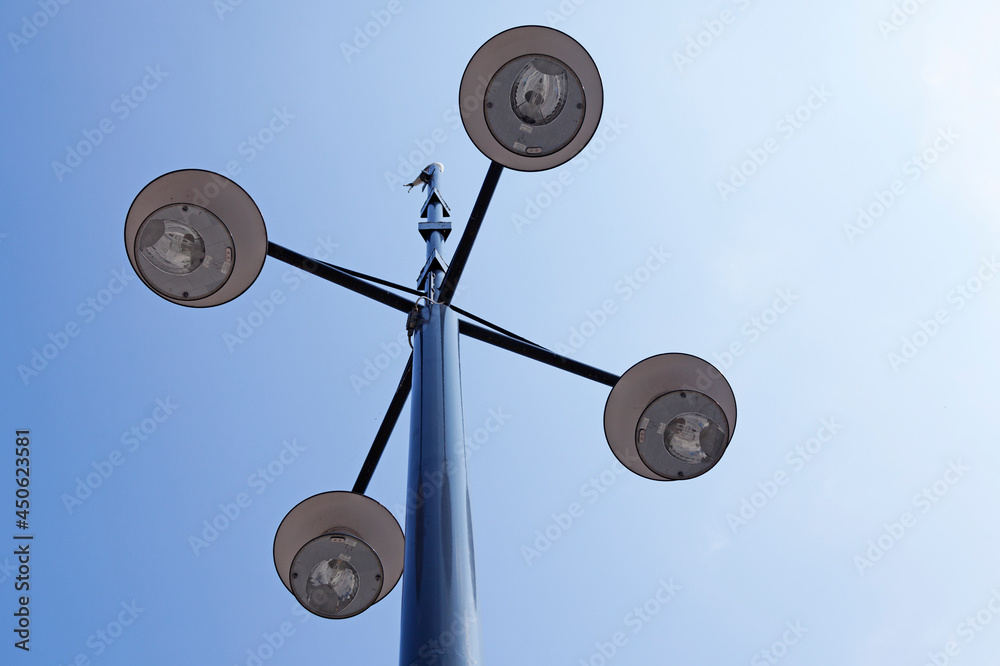 street lighting with four lamps in a cross street lighting with four lamps in a cross