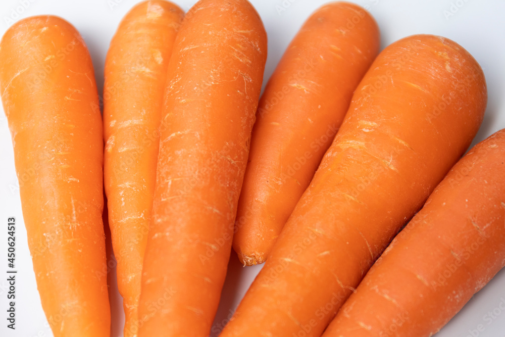 CARROTS ON WHITE PLATE MACRO PHOTOGRAPHY. selective focus CARROTS ON WHITE PLATE MACRO PHOTOGRAPHY. selective focus