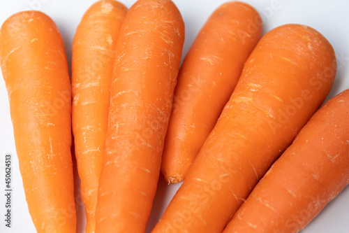 CARROTS ON WHITE PLATE MACRO PHOTOGRAPHY. selective focus