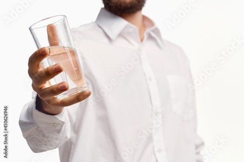 man in white shirt drinking water isolated background © SHOTPRIME STUDIO