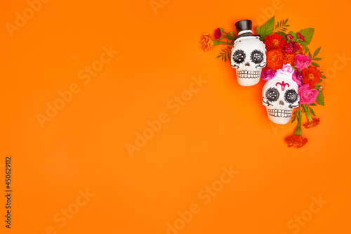 Day of the dead, Dia De Los Muertos, halloween Celebration Background. Sugar Skull, calaverita, marigolds flowers, Orange Copy Space. Traditional Mexican culture festival flyer. Flat lay, top view. photo