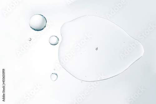 Cosmetic liquid water serum or waterproof material on white background