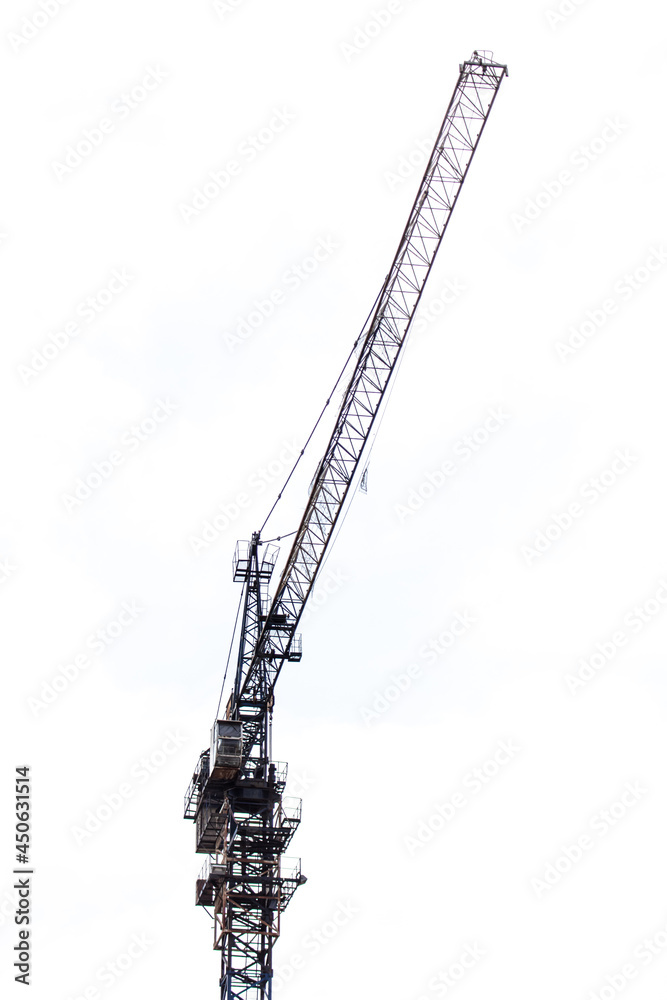 Metal tower crane on a background of clouds. Metal tower crane on a background of clouds.