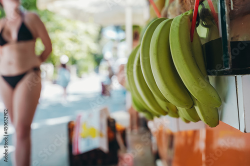 Bananas at the street farmers market. Fresh summer fruits for juice and smoothies. Summer, vitamins, healthy food concept