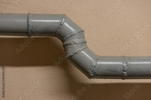 A water pipe is roughly welded from many pieces of pipe. Incorrectly installed sewer pipe