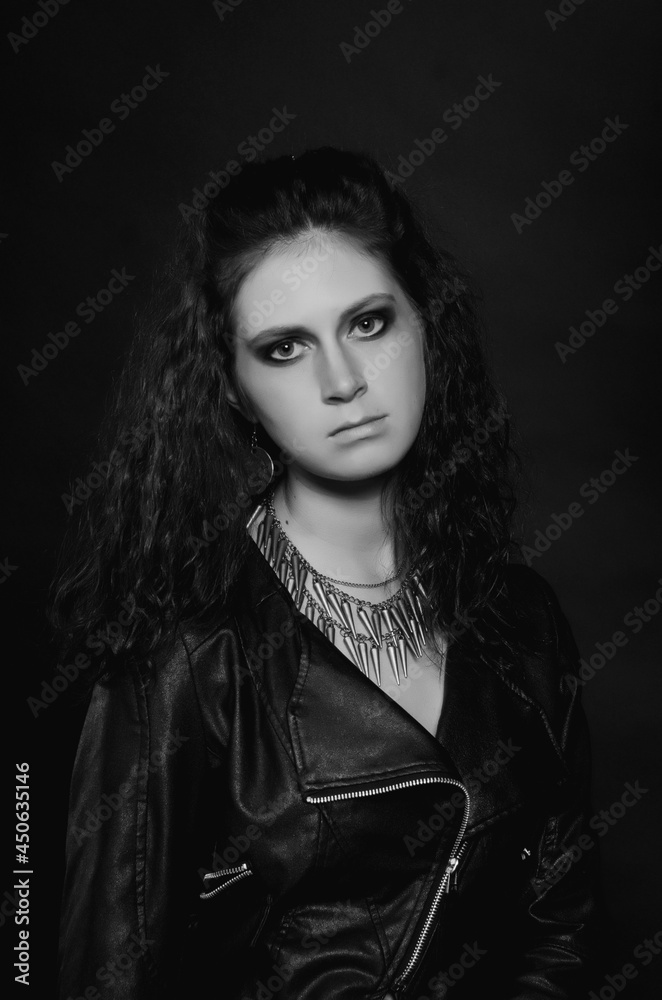 Portrait of sexy young woman posing in black jacket and jeans Portrait of sexy young woman posing in black jacket and jeans