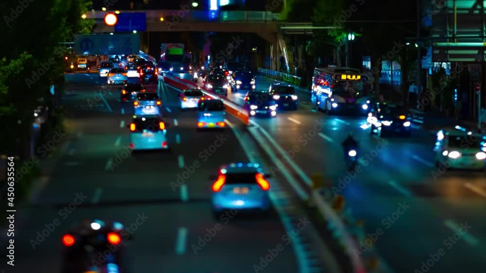 A night timelapse of miniature traffic jam at the downtown street tiltshift A night timelapse of miniature traffic jam at the downtown street tiltshift