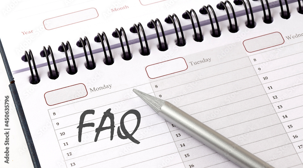 FAQ on the planner with pencil, business concept FAQ on the planner with pencil, business concept