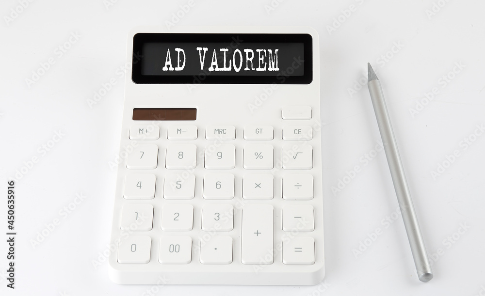 AD VALOREM business text on calculator with pencil AD VALOREM business text on calculator with pencil