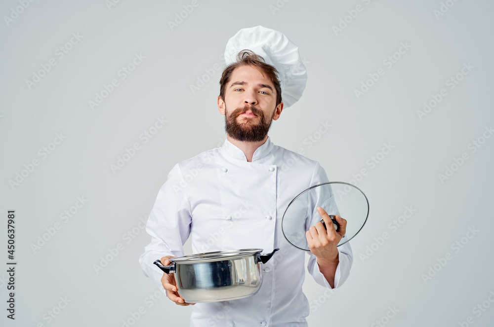 Cheerful male chef kitchenware cooking industry Cheerful male chef kitchenware cooking industry