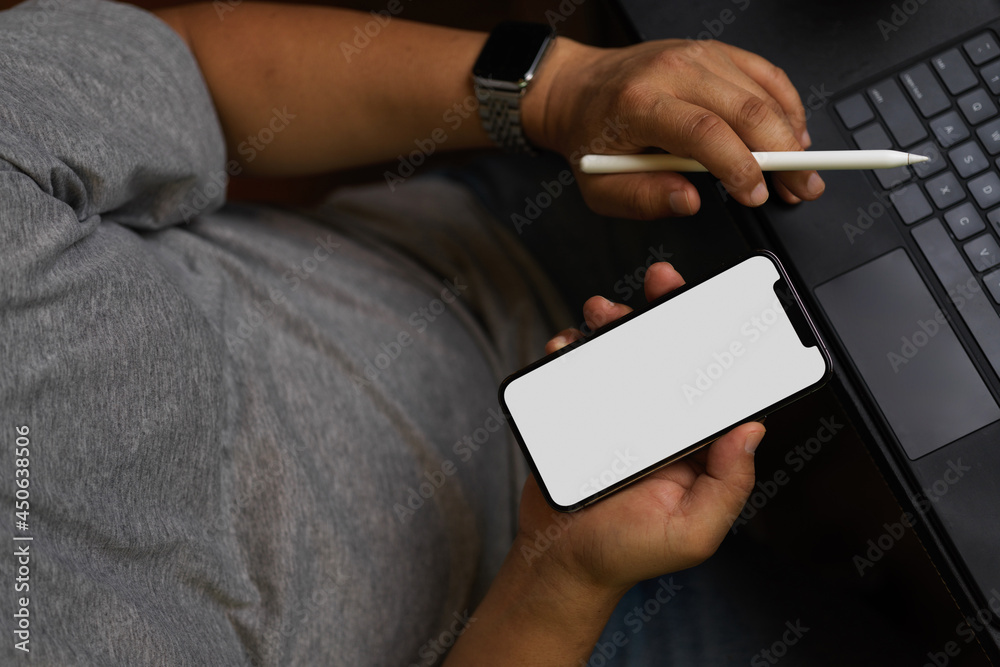 Success man in casual sitting and using smartphone to work Success man in casual sitting and using smartphone to work