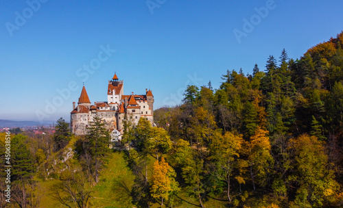 The legendary medieval Bran Castle up on a hill , the presumed residence of Vlad the Impaler , an architectural tourist attraction in Transylvania , Romania , aerial view