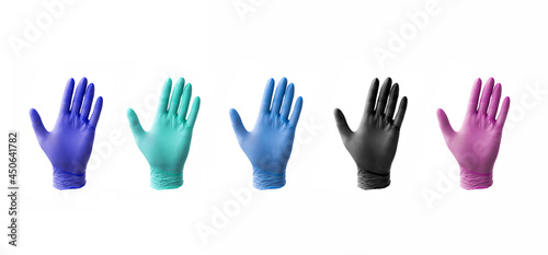 Assortment of nitrile or latex medical gloves isolated on white background with no hands photo