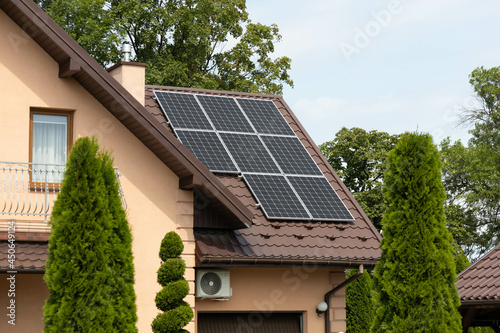 solar panels on a roof of house, modern power solution, environment friendly sun