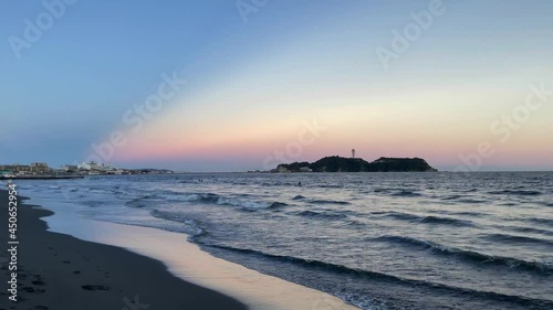 FUJISAWA, KANAGAWA, JAPAN - JULY 2021 : View of beach and magic hour sky at Shonan area near Enoshima island. Wide view, real time shot in dusk. photo