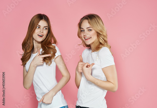 two cute girlfriends in white t-shirts emotions friendship fashion