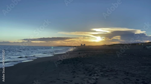 FUJISAWA, KANAGAWA, JAPAN - JULY 2021 : View of beach and magic hour sky at Shonan area near Enoshima island. Wide view, real time shot in dusk. photo