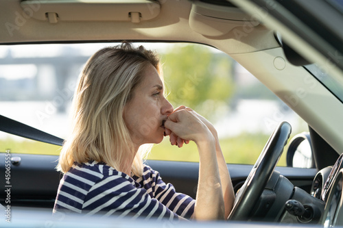 Konstfotografi Serious anxious female driving car