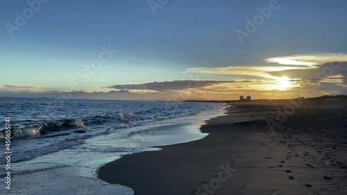 FUJISAWA, KANAGAWA, JAPAN - JULY 2021 : View of beach and magic hour sky at Shonan area near Enoshima island. Wide view, real time shot in dusk. photo