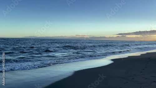 FUJISAWA, KANAGAWA, JAPAN - JULY 2021 : View of beach and magic hour sky at Shonan area near Enoshima island. Wide view, real time shot in dusk. photo