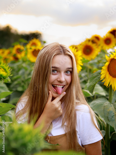 12 year old girl on a field of sunflowers