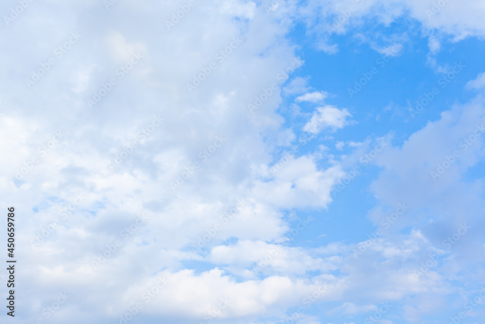 white fluffy clouds in a blue sky. background. white fluffy clouds in a blue sky. background.