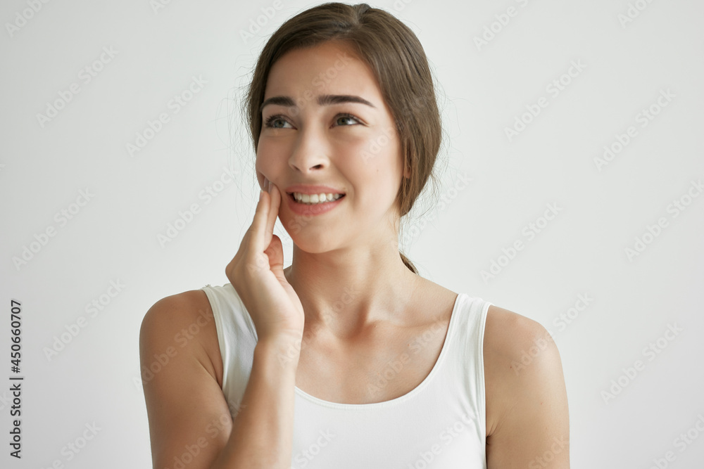 woman in white t-shirt teeth pain dentistry discomfort woman in white t-shirt teeth pain dentistry discomfort