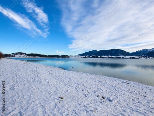 a stunning view of the Forggensee lake (fifth-largest lake in Bavaria) in the winter time. Bavaria, Germany