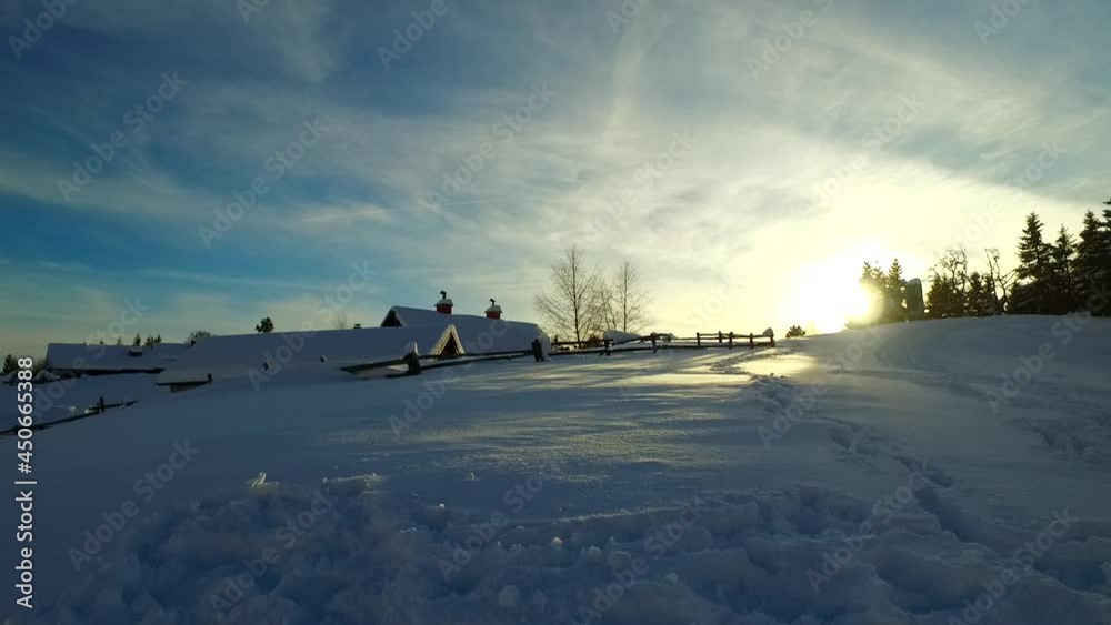 Small village in a cold winter evening, just before sun goes down and cold evening splashes over it. In the cold mountains. Europe. Small village in a cold winter evening, just before sun goes down and cold evening splashes over it. In the cold mountains. Europe.