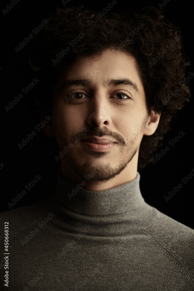 man with curly dark hair