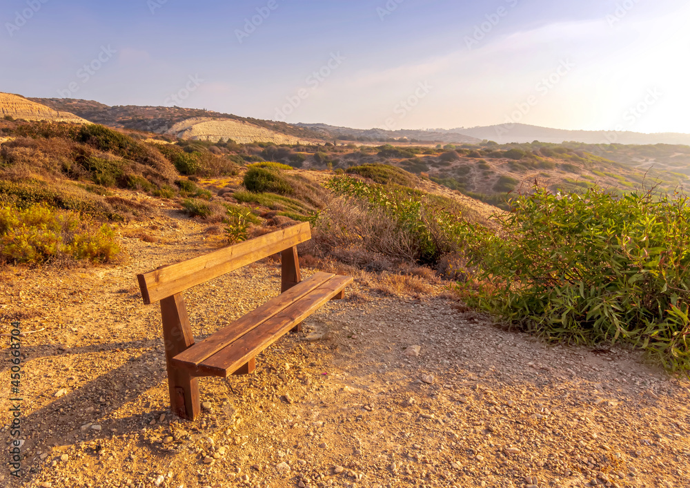 amazing scenic view at a sea shore from a mountain with nice bench on the foreground and blue sky and sea on the background , rest on a rock landscape amazing scenic view at a sea shore from a mountain with nice bench on the foreground and blue sky and sea on the background , rest on a rock landscape