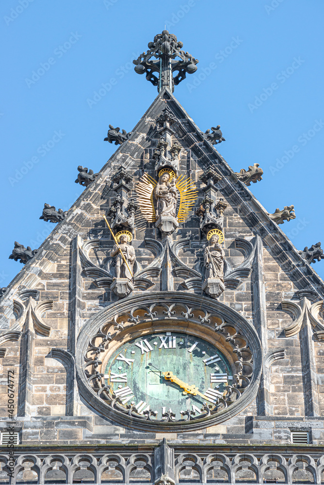 Wall figure of the knight at main facade and clock side of the catholic cathedral in Magdeburg, Germany, closeup