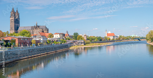 Panoramic view over historical downtown of Magdeburg, old town, Elbe river, new modern houses and Magnificent Cathedral at early Autumn with blue sky and sunny day, Magdeburg, Germany.