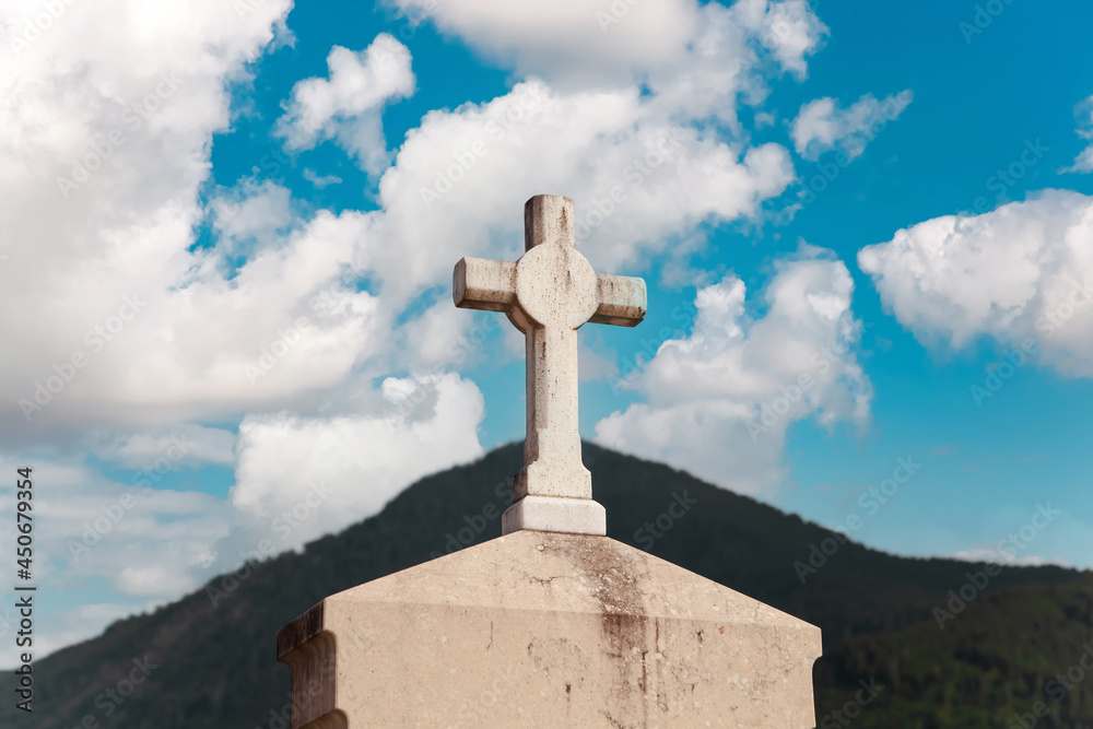 Old graveyard stone religious Cross shape on landscape - scenery