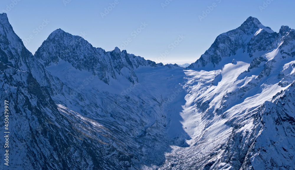 Snow-capped mountain peaks of the Caucasus Mountain Range. Northern snowy mountains of the Caucasus.