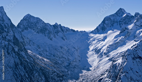 Snow-capped mountain peaks of the Caucasus Mountain Range. Northern snowy mountains of the Caucasus.