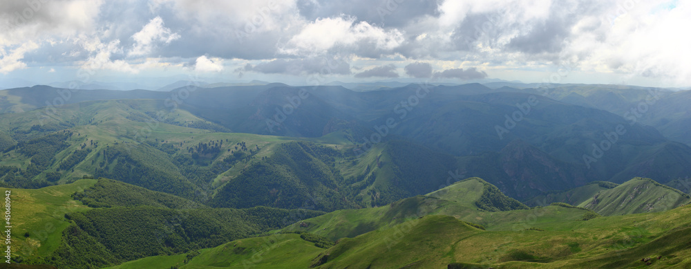 Mountains of the North Caucasus of Russia. Russian nature. Green valleys panoramic view. In the clouds and fog.