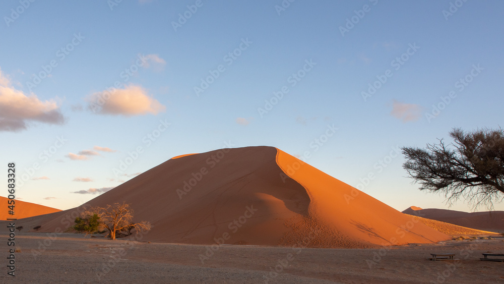 Huge red dune at Sossusvlei National Park, located in the arid Namib desert.