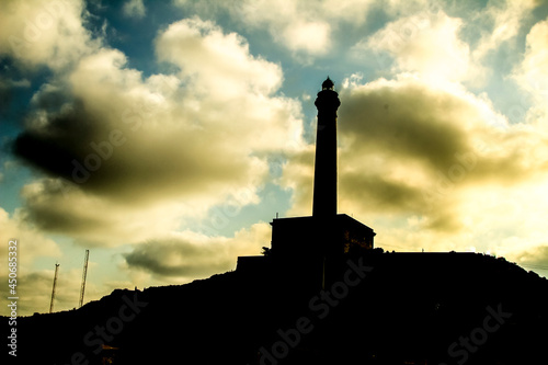 Beautiful Cabo de Palos lighthouse silhouette on a sunny day of summer