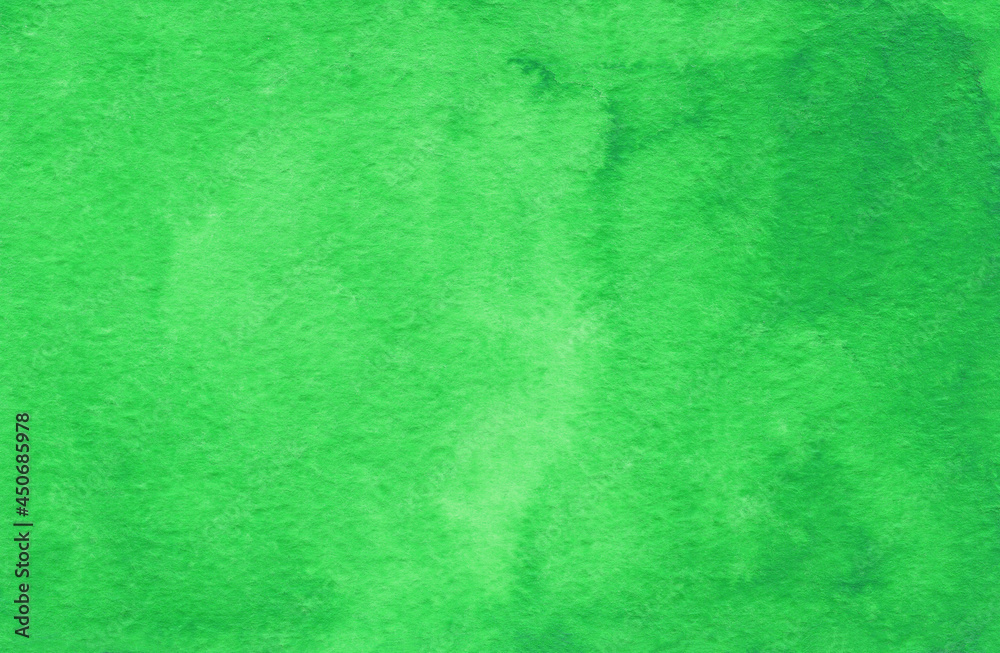 Green abstract watercolor background on textured paper. Hand made watercolor backdrop