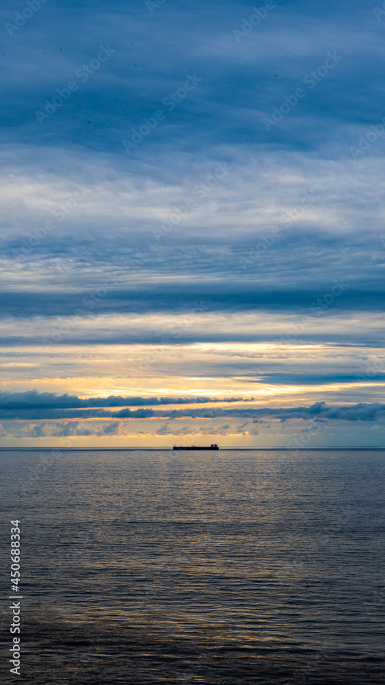 Fototapeta premium Blue sky, sunset and sea.