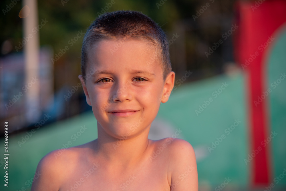A nice boy on the beach at sunset A nice boy on the beach at sunset