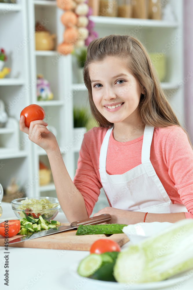 Close up portrait of attractive young girl holding tomato Close up portrait of attractive young girl holding tomato
