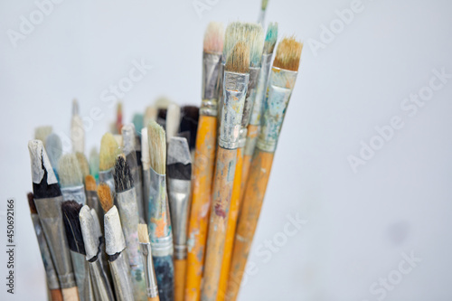 Row of artist paint brushes closeup