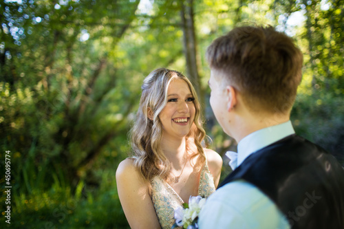 Eager attractive young woman smiles at her partner in anticipation photo